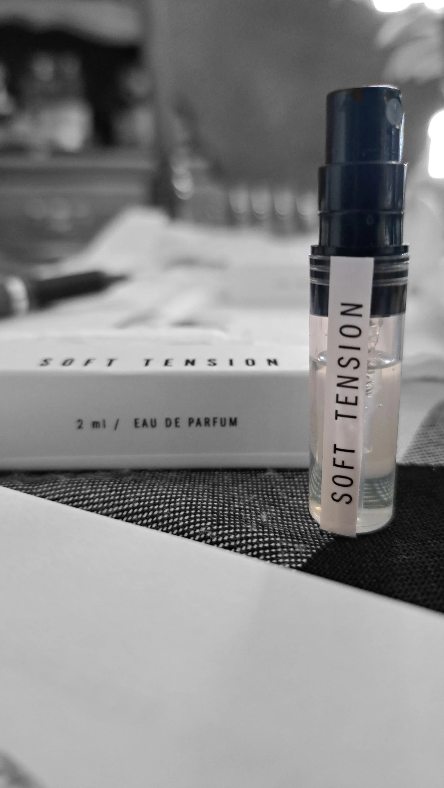 Andrea Maack Soft Tension perfume sample with white packaging in the background.