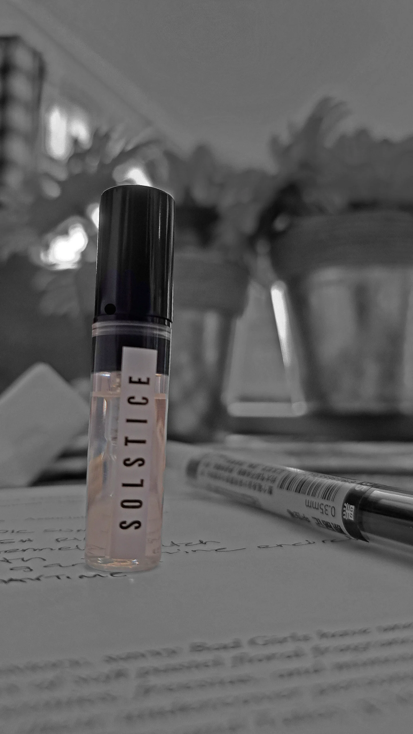 Andrea Maack Solstice perfume sample standing upright on a handwritten fragrance notebook