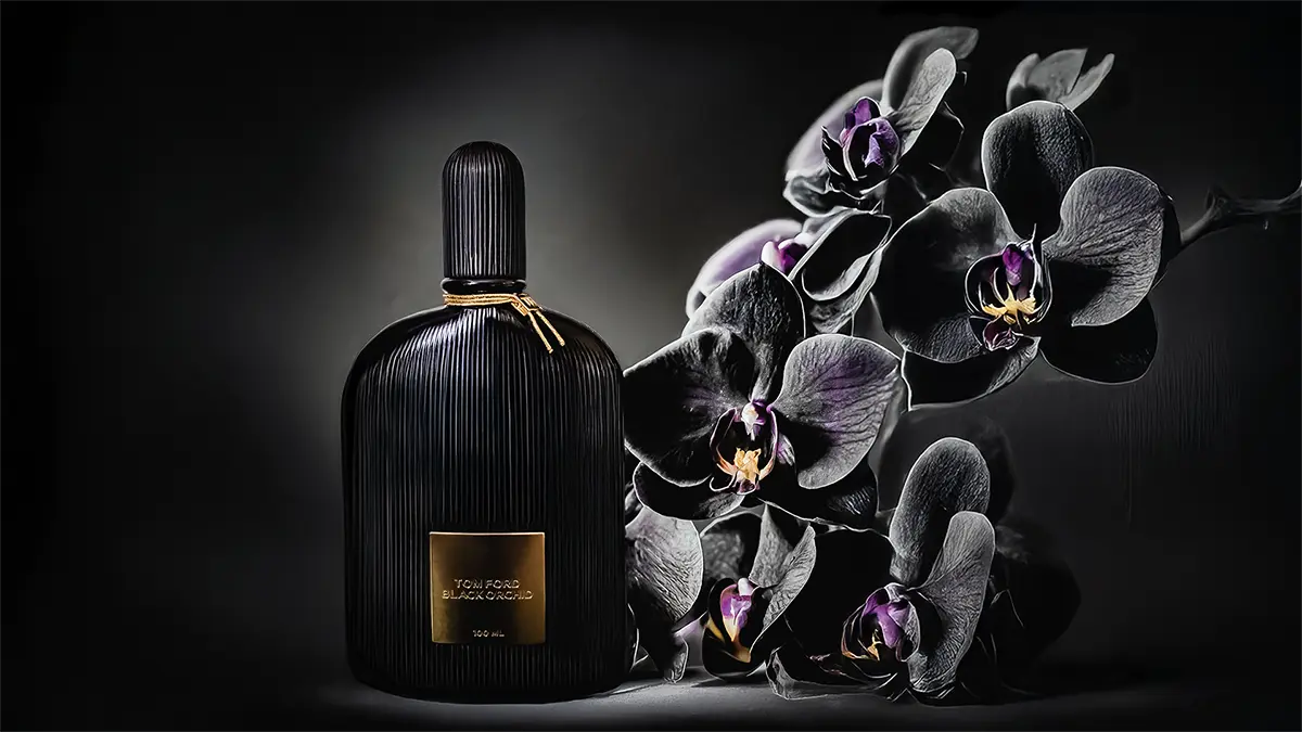 Tom Ford Black Orchid perfume bottle surrounded by black orchids on a dark background