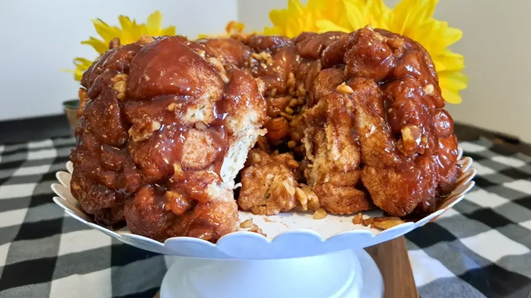 Salted caramel walnut pull-apart bread with a slice removed, showing the soft interior.