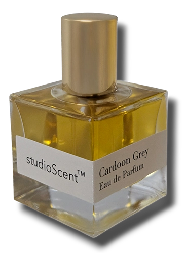 Minimalist square glass perfume bottle with a gold cap and white label, containing light yellow-tinted liquid.