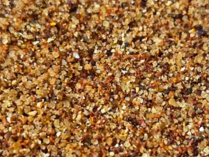 Close-up of homemade BBQ spice rub showing coarse brown sugar, paprika, and spices blended together.